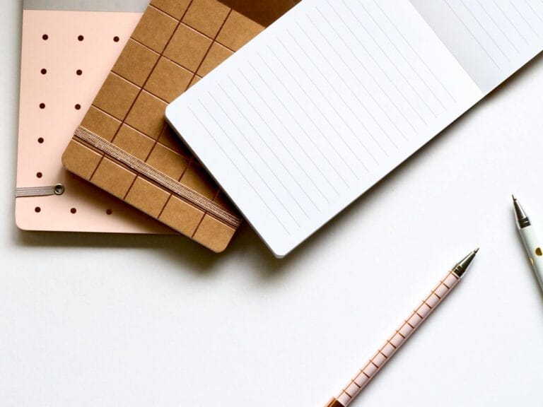 pad with pens on table