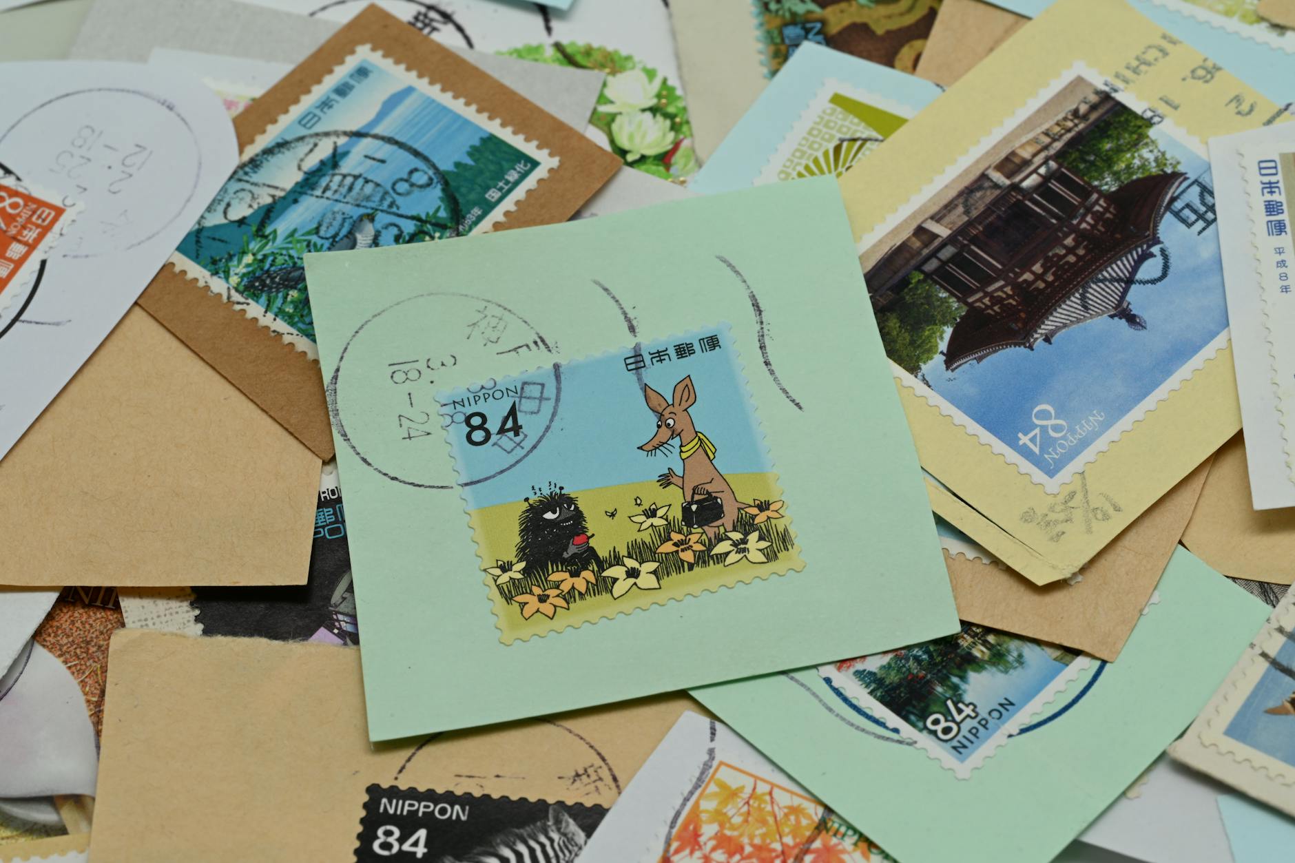 assorted japanese postage stamps and envelopes