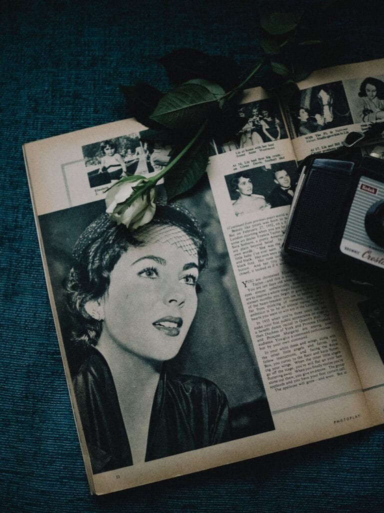 vintage magazine spread with retro camera and rose