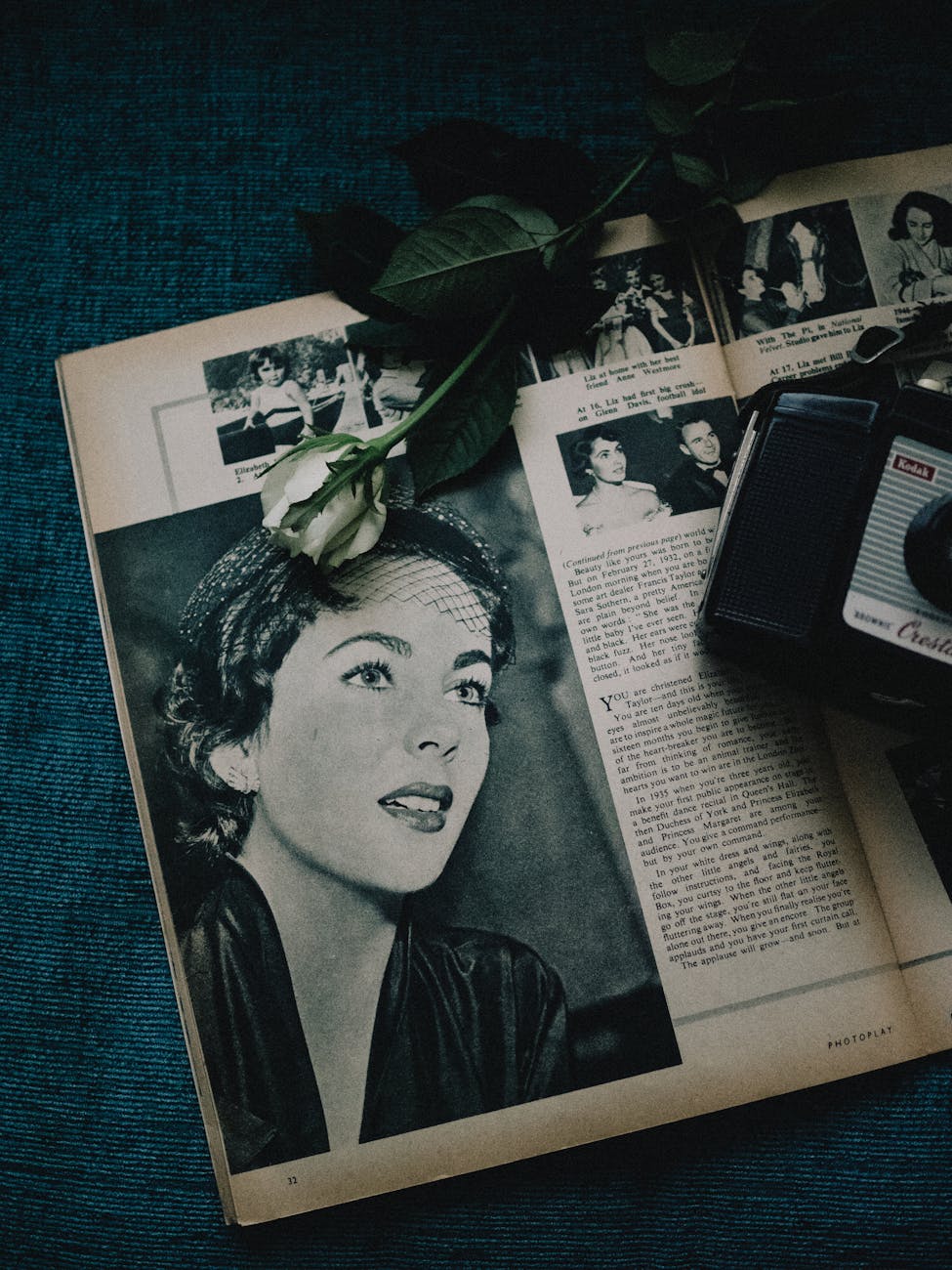 vintage magazine spread with retro camera and rose