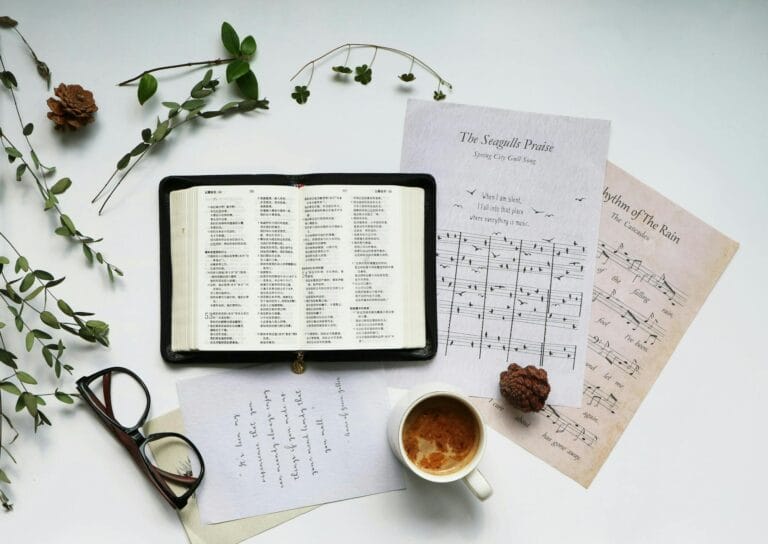 flat lay of the bible and psalms