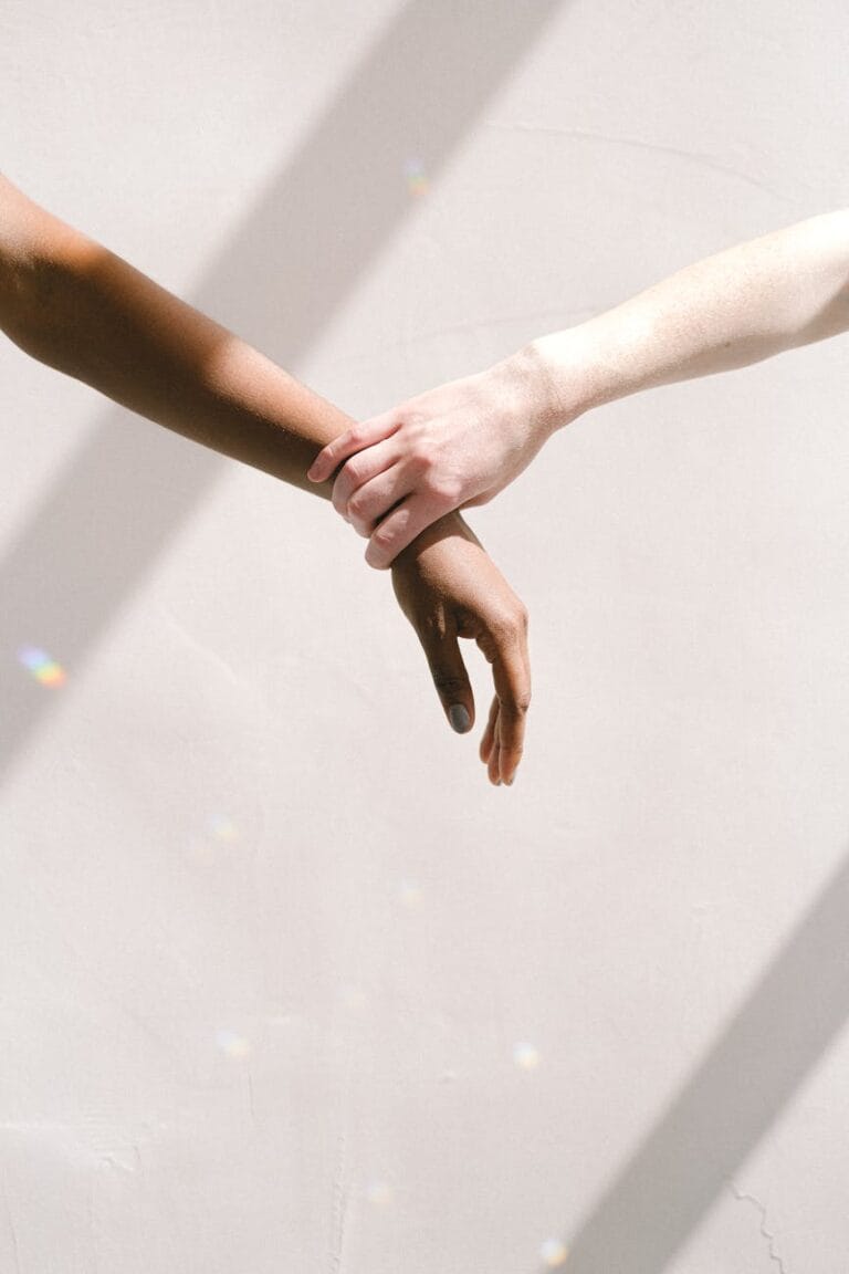 hand holding someone by the wrist