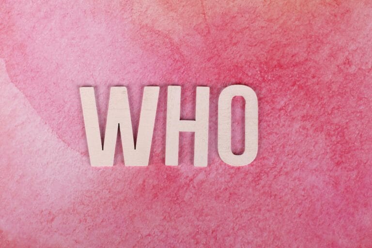 who text on a pink surface