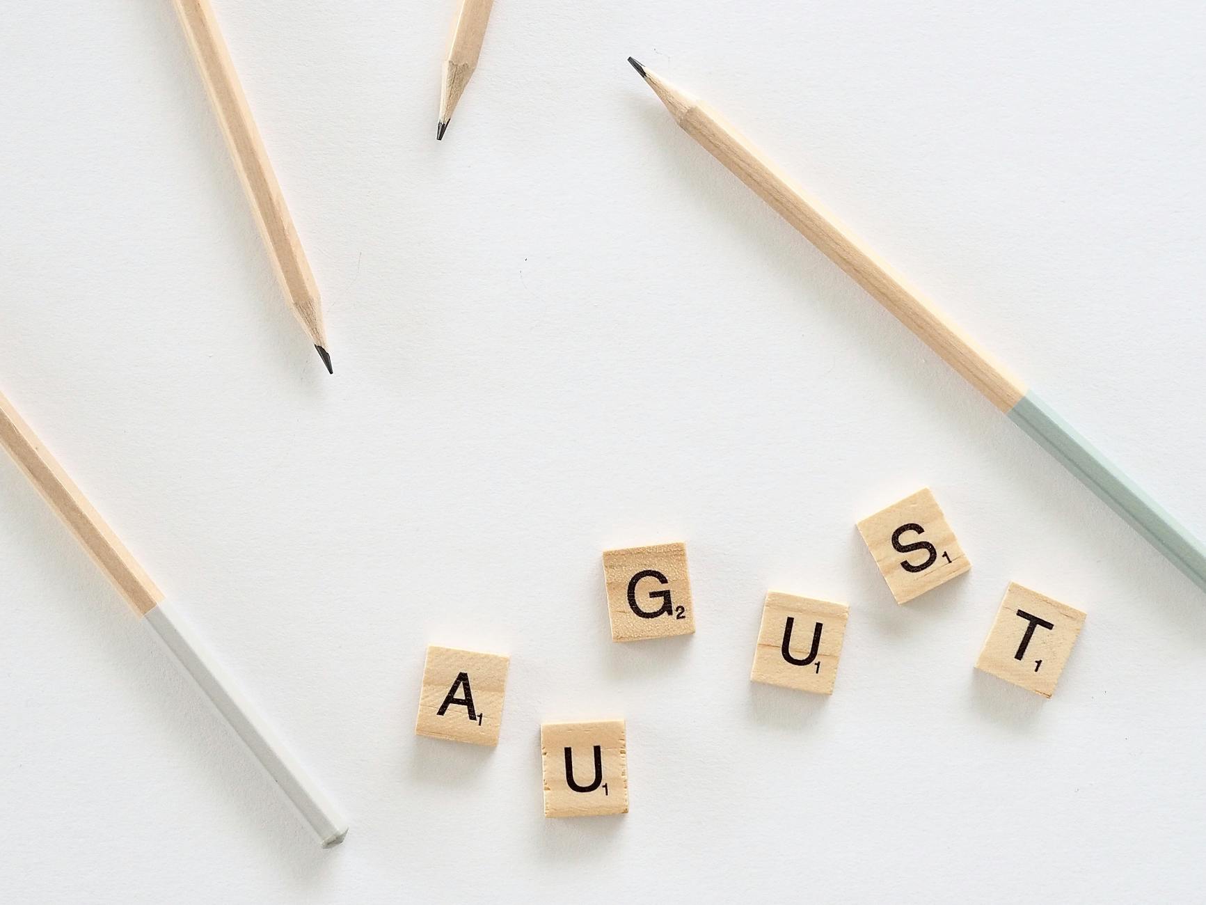 composition of august letters on table