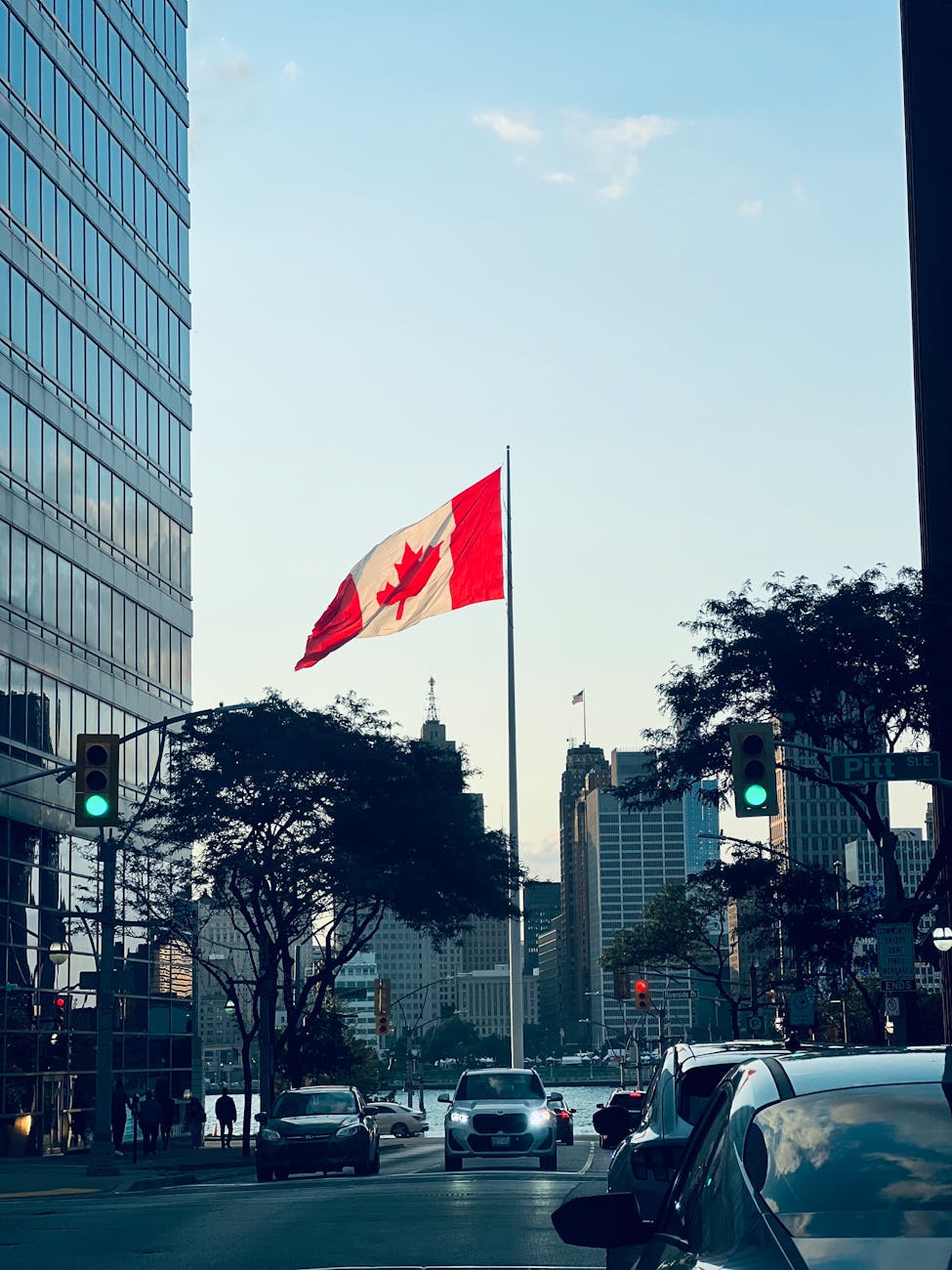windsor cityscape with canadian flag at twilight
