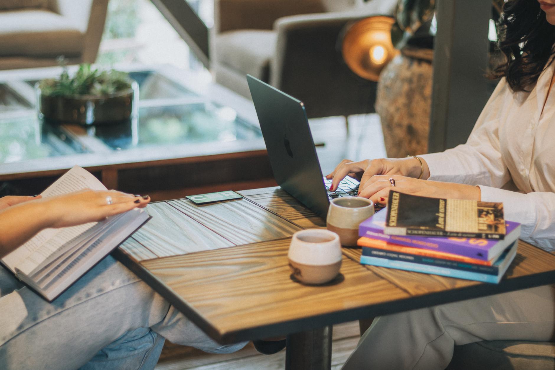 casual work environment with laptop and books