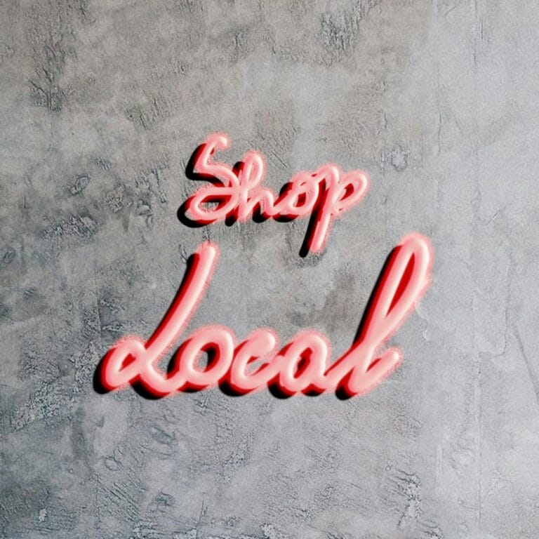 a neon sign on concrete wall