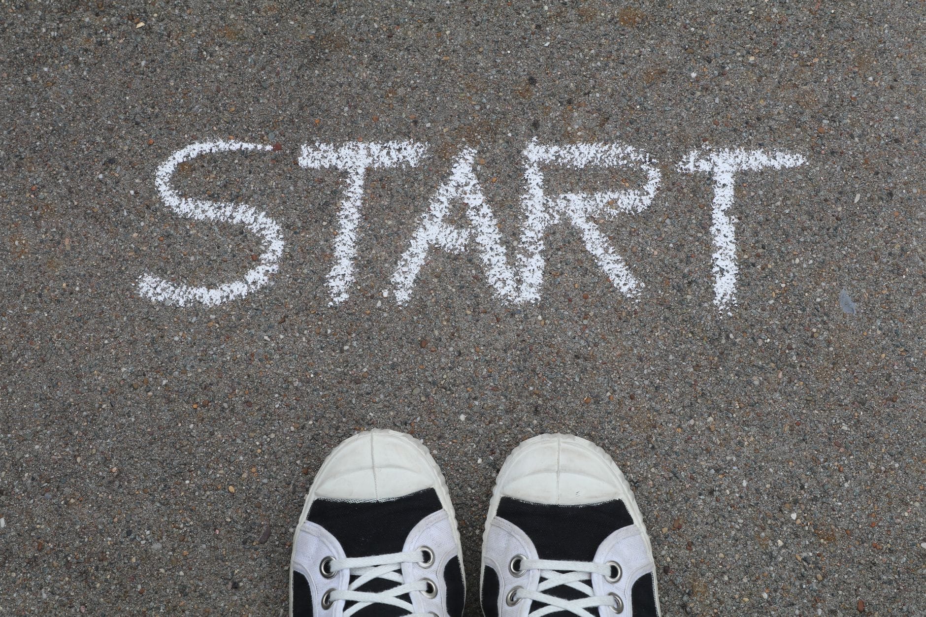 start written on asphalt