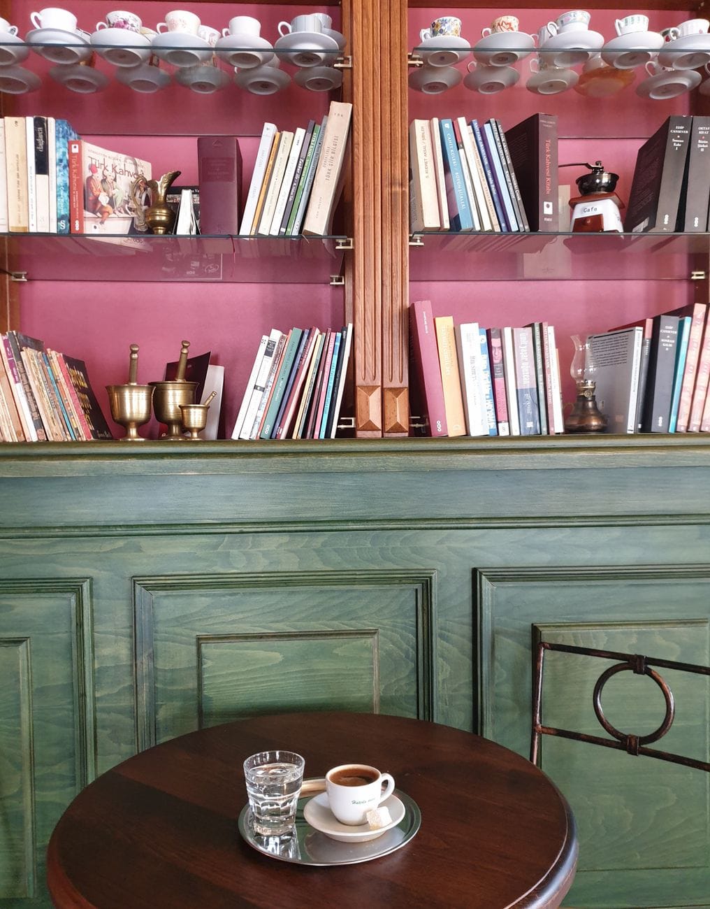 books on pink and brown shelf
